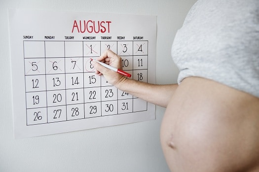 Pregnant woman counting down for delivery date